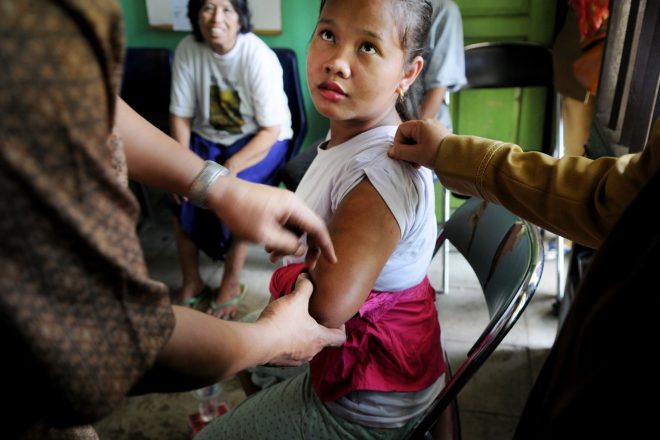 A person affected by leprosy with senseless spots her arm due to leprosy complications