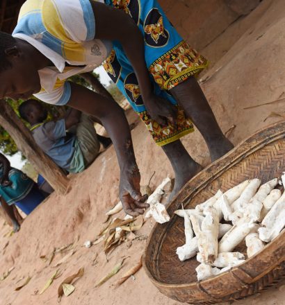 Lidia dries cassava in the sun