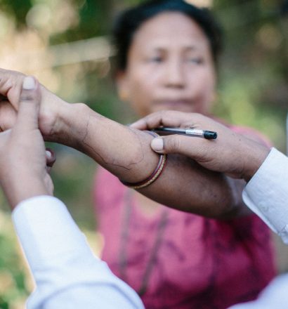 Leprosy doctor examines patient