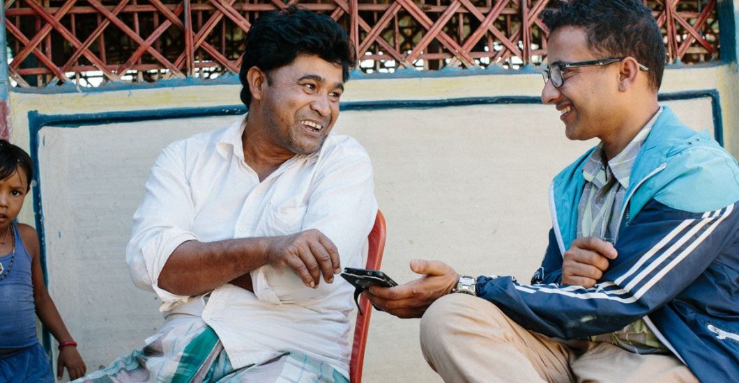 Leprosy doctor and person affected by leprosy laughing together