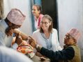 Liesbeth Miedras and leprosy doctor from NLR checking a person affected by leprosy in Nepal            