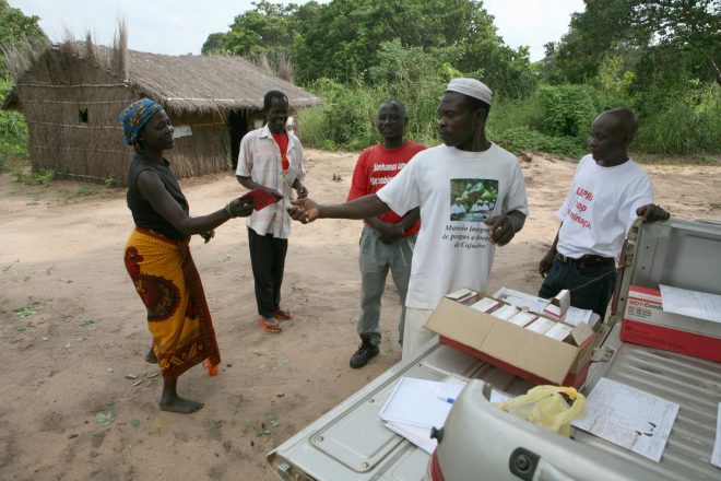 Person affected by leprosy receiving her treatement pills