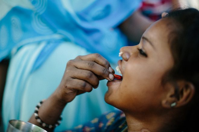 A close contact of a person affected by leprosy takes preventative medication against leprosy