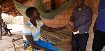 Lidia, a person affected by leprosy, receives leprosy treatment pills                