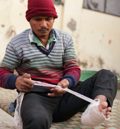 Ajay, a person affected by leprosy, takes care of his own feet to prevent deformities